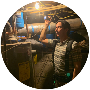 David inspecting the basement of a home.