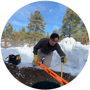 David preforming a septic inspection at a residential home.